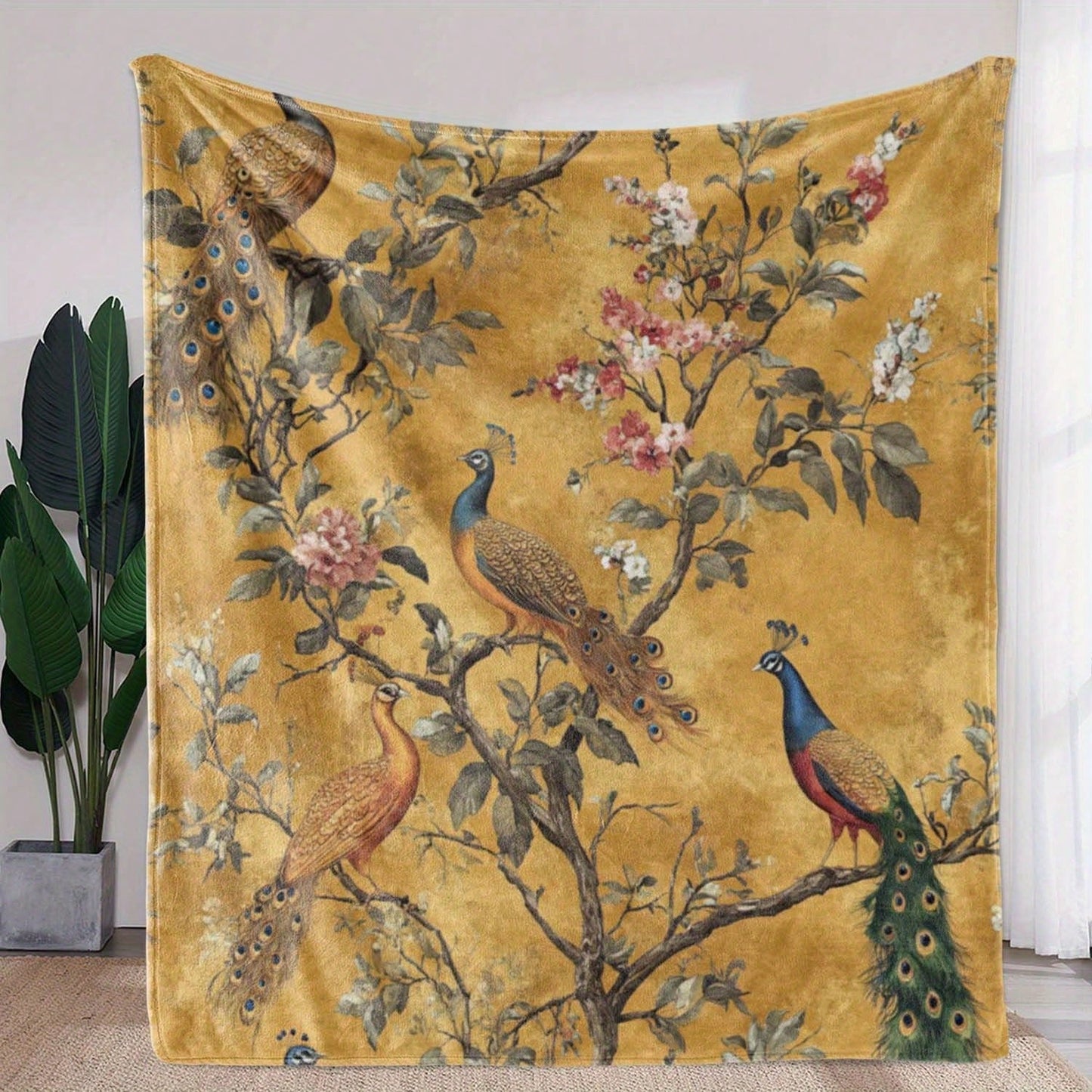 Soft and cozy mustard yellow blanket featuring an elegant peacock print – perfect for adding warmth, color, and a touch of luxury to your bedroom or living room décor.