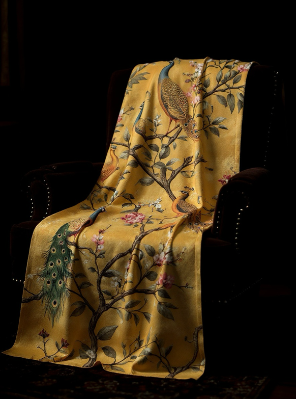 Soft and cozy mustard yellow blanket featuring an elegant peacock print – perfect for adding warmth, color, and a touch of luxury to your bedroom or living room décor.