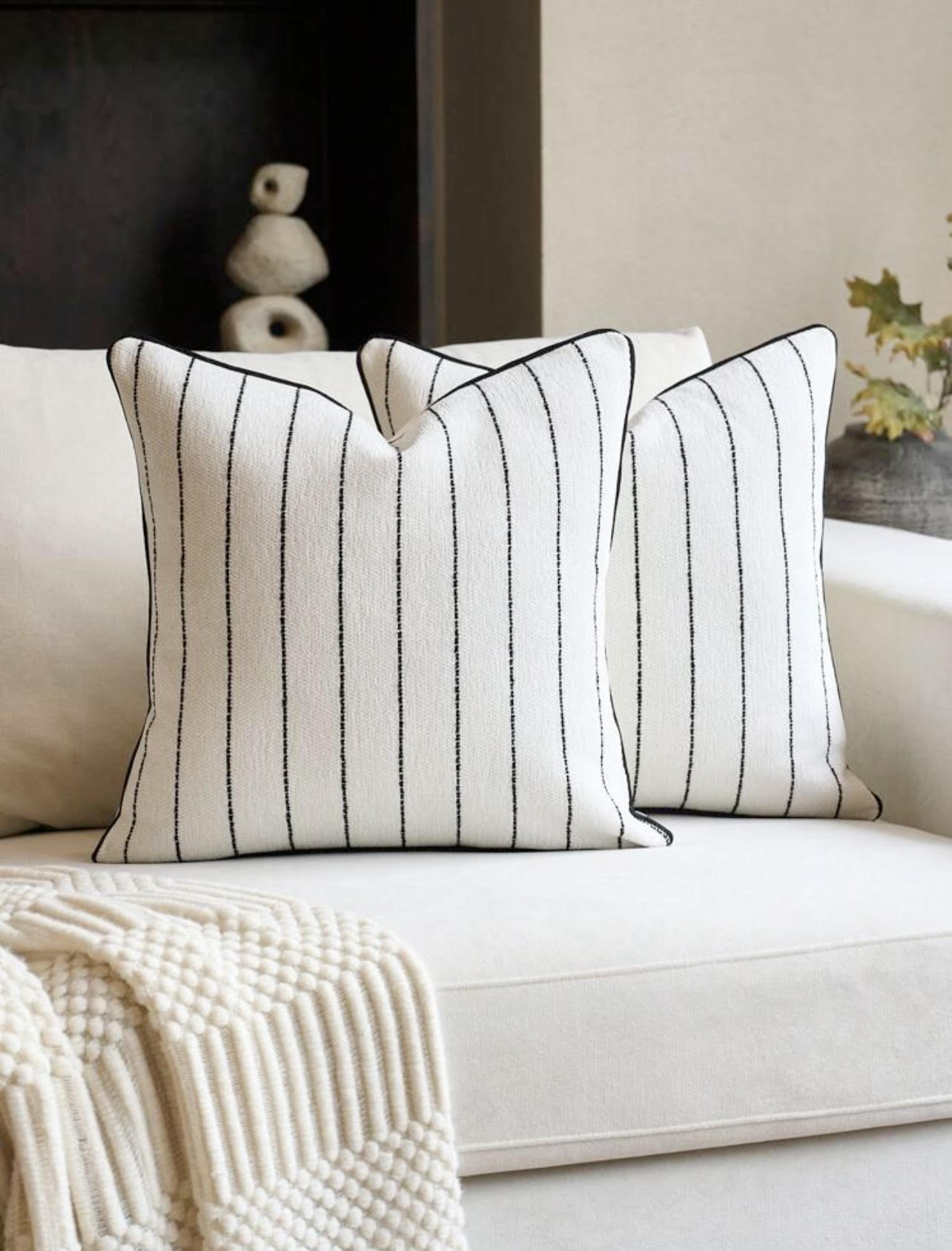Add comfort, color, and character to any room with our curated collection of throw pillows.