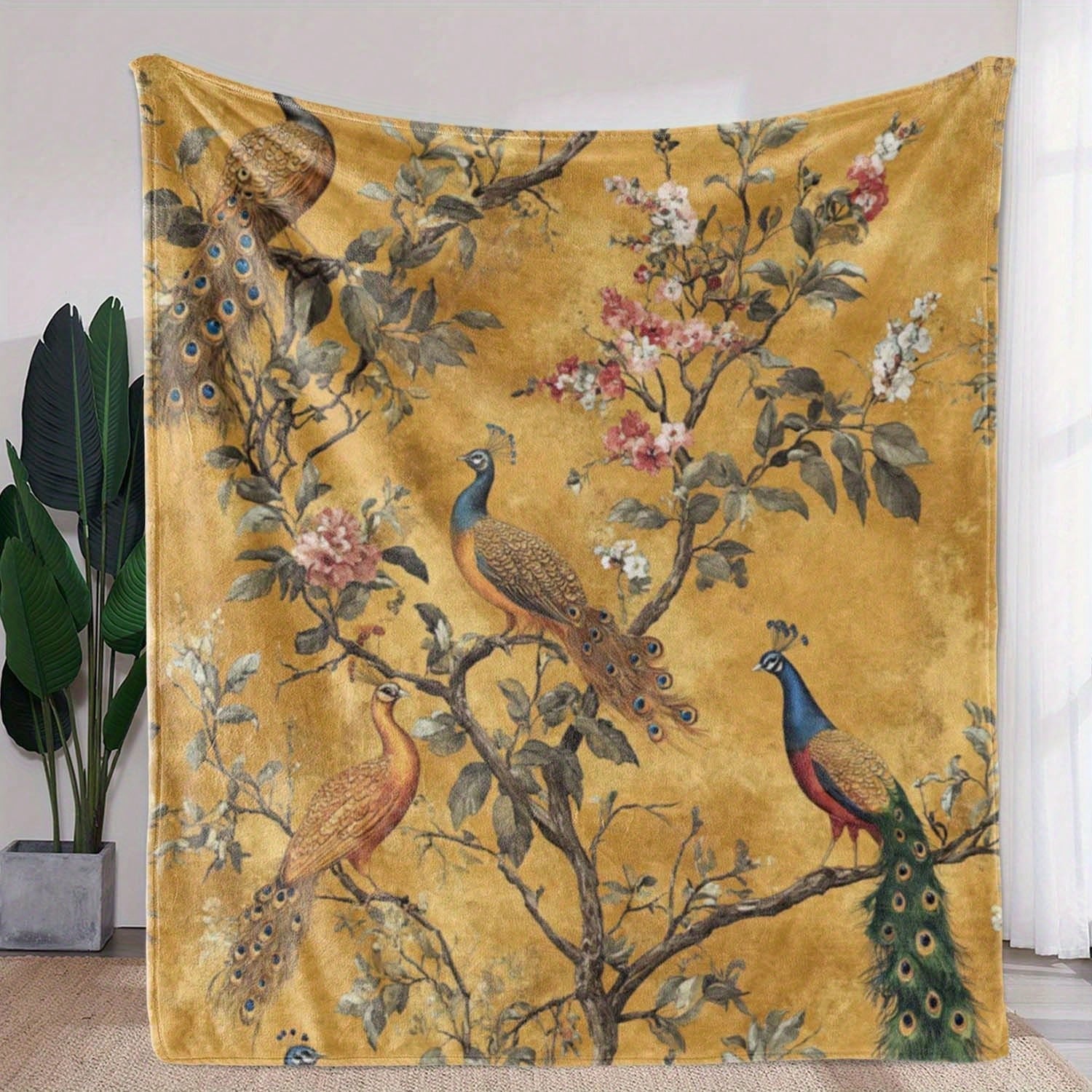 Soft and cozy mustard yellow blanket featuring an elegant peacock print – perfect for adding warmth, color, and a touch of luxury to your bedroom or living room décor.