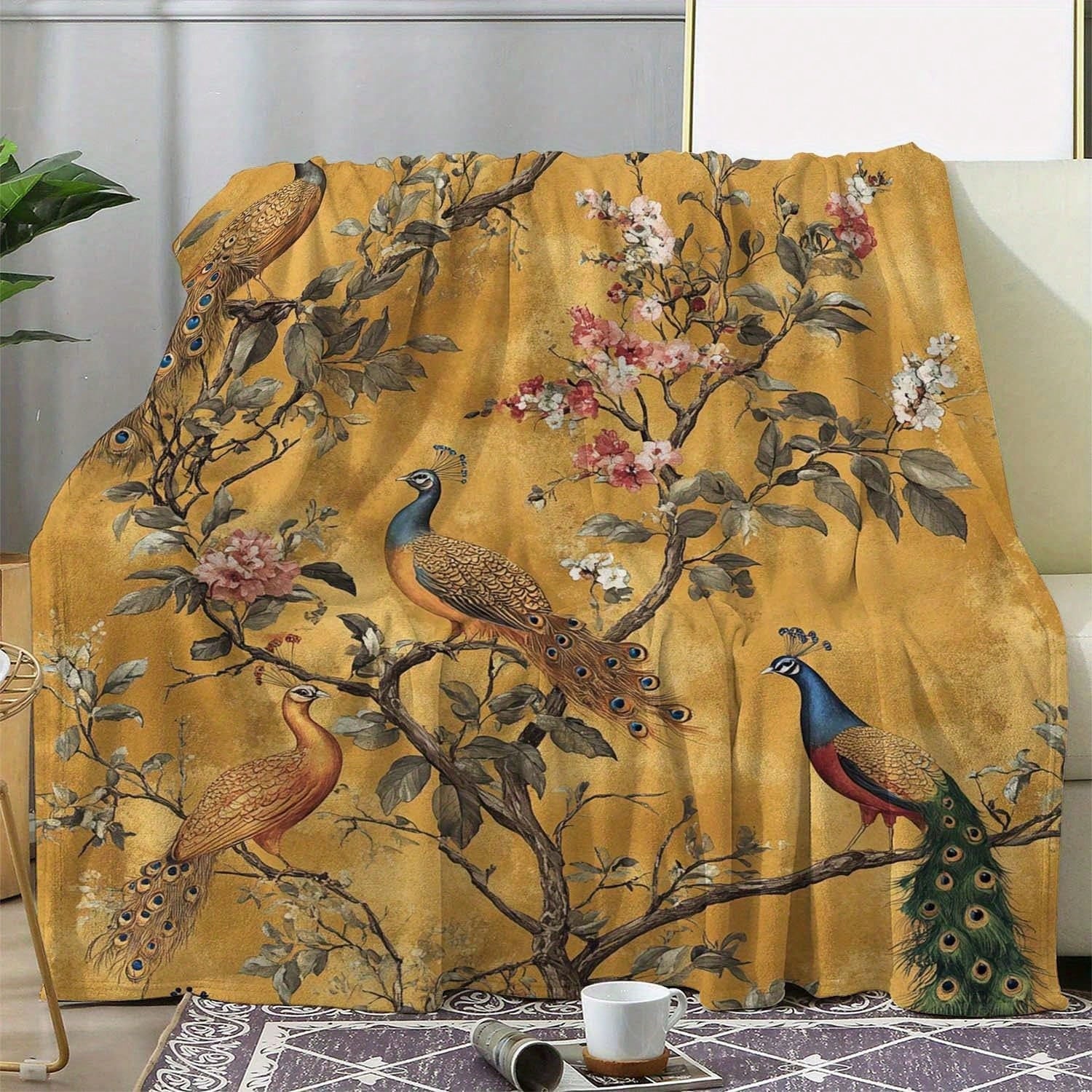 Soft and cozy mustard yellow blanket featuring an elegant peacock print – perfect for adding warmth, color, and a touch of luxury to your bedroom or living room décor.